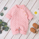 Combinaison pour bébé en tricot de couleur unie
