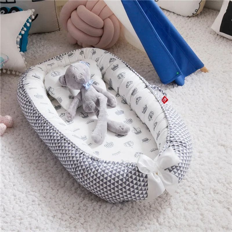 Réducteur de Lit Bébé - Sécurité et Confort | DreamCocoon