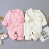 Combinaison pour bébé en tricot de couleur unie