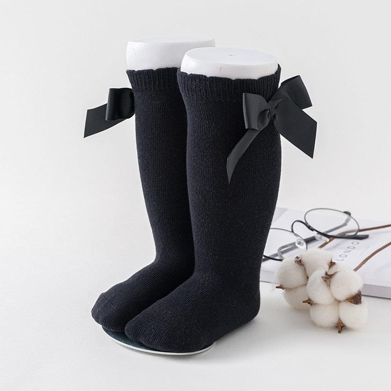 Paire de chaussette noires avec noeuds de papillon