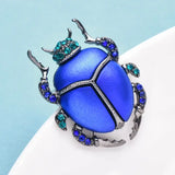 Broche scarabee bleu Elegante