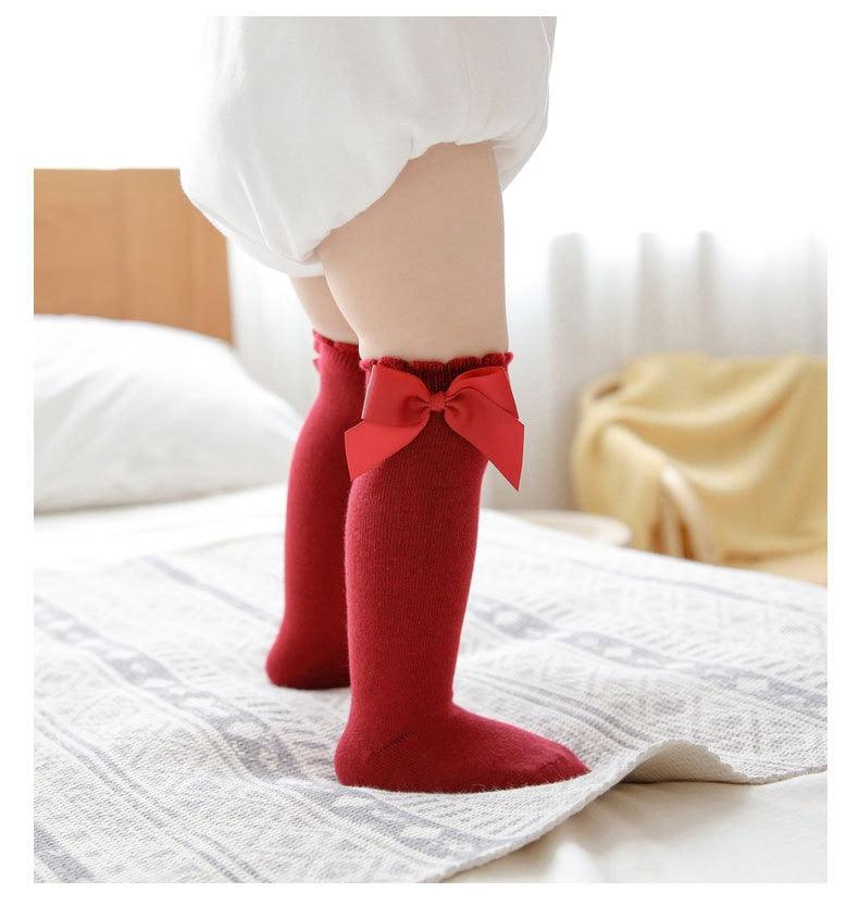 Paire de chaussette rouge avec noeuds de papillon pour bébé